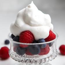 berries with cream on top