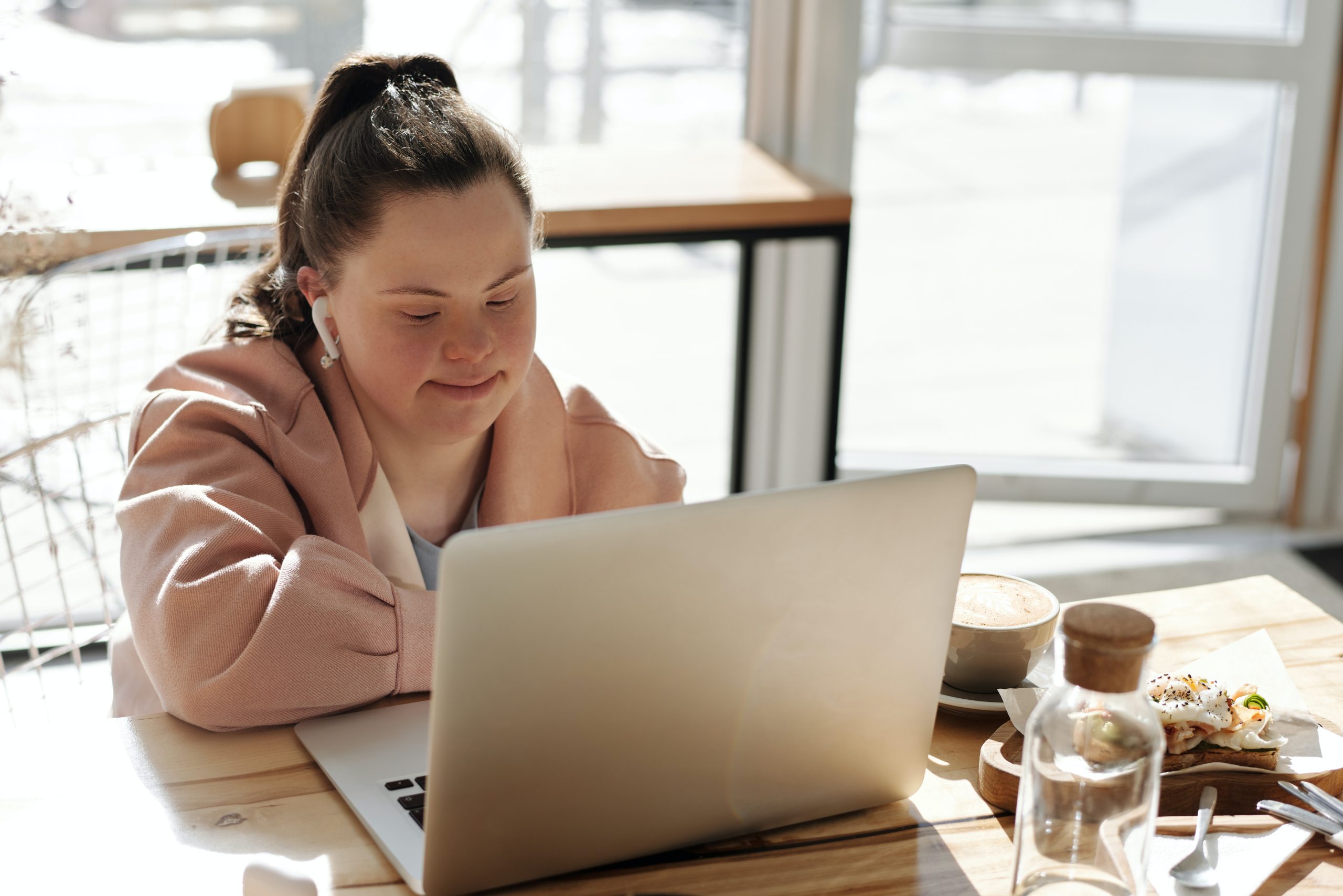 woman with Down syndrome using laptop