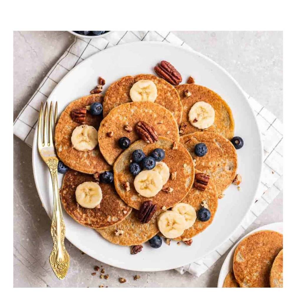 banana oatmeal pancakes on a plate with toppings