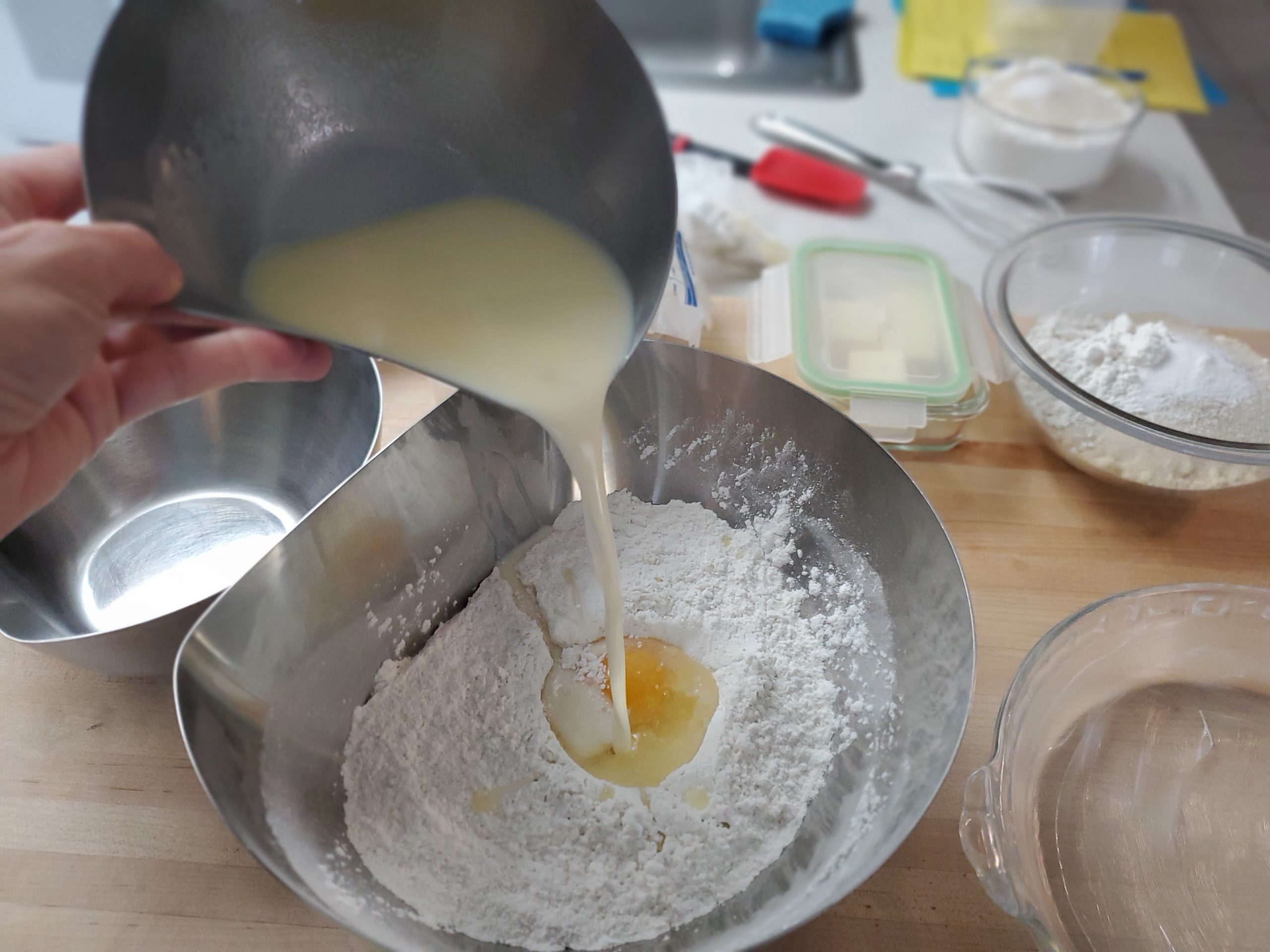 photo of pouring ingredients between two bowls