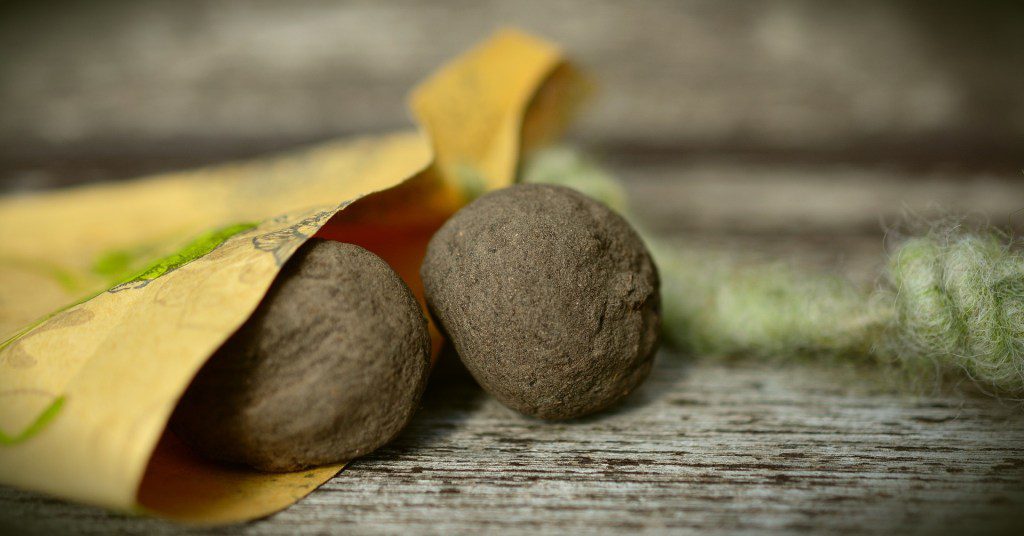photo of two seed bombs sitting on a table